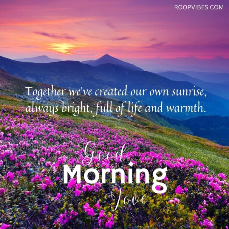 Beautiful Sunrise Over Mountains And A Valley Of Pink Flowers With A Good Morning Love Quote
