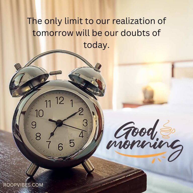 Alarm Clock On A Table With Bedroom In Soft Bokeh Effect Accompanied With A Good Morning Wish And A Inspirational Quote