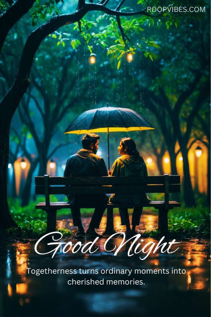 Young Couple Sitting On A Park Bench Under An Umbrella At Night In The Rain With A Good Night Wish