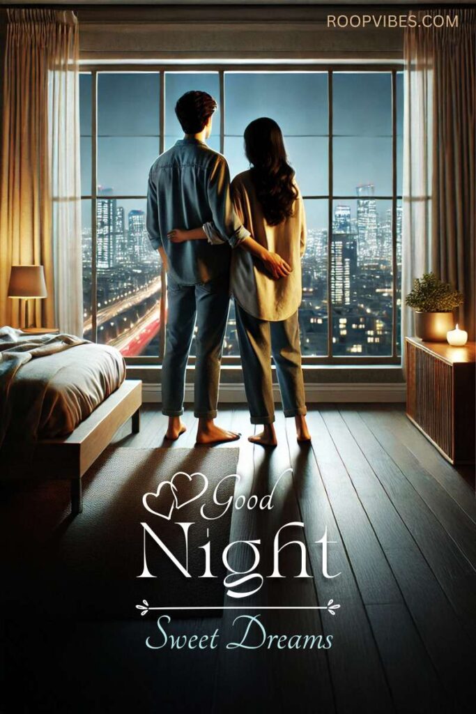 Young Indian Couple Standing Near The Bedside Window Looking At The Night Cityscape Coupled With A Good Night Wish.