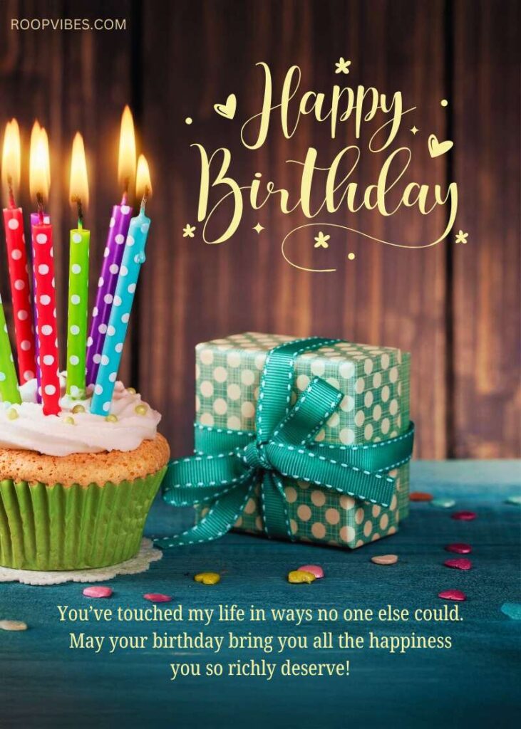 Birthday Greeting With A Colorful Cupcake, Polka-Dot Candles, And A Green Gift Box Tied With A Ribbon On A Wooden Table With Happy Birthday Message.