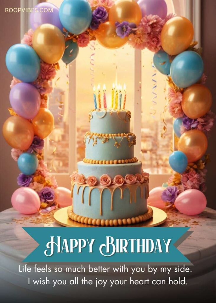 Birthday Celebration With A Pastel Blue Layered Cake, Floral Decorations, And Colorful Balloons In An Arch With Happy Birthday Message